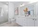 Bright bathroom featuring a modern double vanity with modern fixtures and glass enclosed shower at 532 W Plaza Pl # 3, Tampa, FL 33602