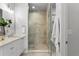 Bright bathroom with a single vanity featuring modern fixtures and a tiled glass-enclosed shower at 532 W Plaza Pl # 3, Tampa, FL 33602