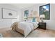 Sun-filled bedroom featuring stylish decor, plush rug, and large windows showcasing outdoor views at 532 W Plaza Pl # 3, Tampa, FL 33602