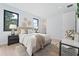 Well-lit bedroom featuring large windows, modern decor, and hardwood floors at 532 W Plaza Pl # 3, Tampa, FL 33602