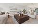Open-concept living room with comfortable seating, modern decor, and seamless flow to the kitchen at 532 W Plaza Pl # 3, Tampa, FL 33602