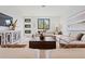 Bright living room features a large neutral sectional, modern decor, and a view to the outside at 532 W Plaza Pl # 3, Tampa, FL 33602