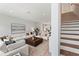 Bright, open living room with plush seating and seamless flow to kitchen and stairway at 532 W Plaza Pl # 3, Tampa, FL 33602