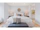 Bright main bedroom with two side tables, modern decor, and glimpses of the bathroom at 532 W Plaza Pl # 3, Tampa, FL 33602