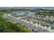 Aerial view showing the neighborhood layout, landscaping and small body of water at 5336 Patano Loop, Palmetto, FL 34221