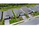 Aerial shot of several homes with brick paver driveways on a lush, green street at 5336 Patano Loop, Palmetto, FL 34221