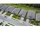 An aerial view of several single-Gathering homes with well-manicured lawns in a neat, orderly neighborhood at 5336 Patano Loop, Palmetto, FL 34221