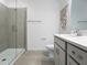 Modern bathroom with glass-enclosed shower and vanity with sink at 5336 Patano Loop, Palmetto, FL 34221