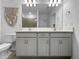 Bathroom with dual vanity, mirrors and stylish decor at 5336 Patano Loop, Palmetto, FL 34221