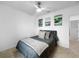Cozy bedroom with soft gray bedding and decorative wall art at 5336 Patano Loop, Palmetto, FL 34221
