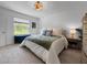 Comfortable bedroom with bright, natural light from a large window at 5336 Patano Loop, Palmetto, FL 34221