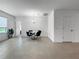 Spacious dining area with neutral tile flooring, a modern chandelier, and ample natural light at 5336 Patano Loop, Palmetto, FL 34221
