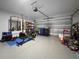 Interior of garage showing pull-up bar, workout equipment, and storage at 5336 Patano Loop, Palmetto, FL 34221