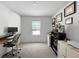 Functional home office featuring a desk, storage shelves, and natural light from a window at 5336 Patano Loop, Palmetto, FL 34221