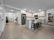 Open-concept kitchen with a large island, stainless steel appliances, and a seamless flow to the living spaces at 5336 Patano Loop, Palmetto, FL 34221