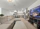Open-concept living space featuring a modern kitchen, comfortable seating, and a seamless flow for entertaining at 5336 Patano Loop, Palmetto, FL 34221