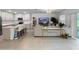 Open-concept living room and kitchen with island and breakfast bar seating at 5336 Patano Loop, Palmetto, FL 34221