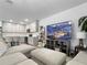 Comfortable living room with modern television and neutral-toned furnishings at 5336 Patano Loop, Palmetto, FL 34221