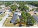 Aerial view of neighborhood homes and mature trees on sunny day at 5618 Halifax Dr, Tampa, FL 33615