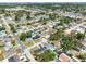 Wide aerial view of homes in an established neighborhood on a sunny day at 5618 Halifax Dr, Tampa, FL 33615