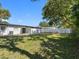 Large, flat backyard surrounded by a privacy fence and mature trees at 5618 Halifax Dr, Tampa, FL 33615
