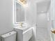 Stylish bathroom featuring a modern vanity, LED mirror, gold faucet, and an adjacent bedroom at 5618 Halifax Dr, Tampa, FL 33615