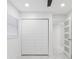 Well-lit bedroom featuring marble-look floors, a closet, recessed lights, and access to adjacent rooms at 5618 Halifax Dr, Tampa, FL 33615