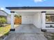 Attached carport featuring sturdy support columns and access to the front entrance at 5618 Halifax Dr, Tampa, FL 33615