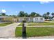 Inviting single-story home boasting a freshly manicured lawn and a convenient covered carport at 5618 Halifax Dr, Tampa, FL 33615