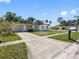 A charming single-story home with a long driveway and a convenient covered carport at 5618 Halifax Dr, Tampa, FL 33615