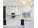 Modern kitchen with stainless steel appliances, quartz countertops, and stylish pendant lighting at 5618 Halifax Dr, Tampa, FL 33615