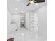 Spacious room with marble floors, a ceiling fan, and access to a full bathroom at 5618 Halifax Dr, Tampa, FL 33615