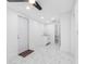 Bright room featuring tile flooring, a utility sink and a doorway to a bathroom at 5618 Halifax Dr, Tampa, FL 33615