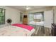 Bedroom with wood-look flooring and a view of the outdoor tiled spa area at 60 Birdsong Ct, Oldsmar, FL 34677