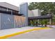 Club entrance featuring a covered walkway, modern architectural design, and lush landscaping at 60 Birdsong Ct, Oldsmar, FL 34677