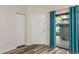 Inviting entryway with wood-look flooring, closet, and sliding glass door at 60 Birdsong Ct, Oldsmar, FL 34677