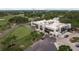 Aerial view of the clubhouse with a view of the golf course and outdoor seating at 60 Birdsong Ct, Oldsmar, FL 34677