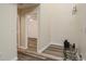 Hallway leading to the bedrooms with wood-look flooring at 60 Birdsong Ct, Oldsmar, FL 34677