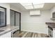 Bright kitchen with stainless steel appliances, granite countertops, and tile floors at 60 Birdsong Ct, Oldsmar, FL 34677