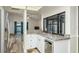 Open kitchen with a breakfast bar that overlooks the living room at 60 Birdsong Ct, Oldsmar, FL 34677