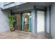 Outdoor patio area with sliding doors leading into the home at 60 Birdsong Ct, Oldsmar, FL 34677