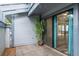 Tiled patio area with sliding glass doors leading to the interior at 60 Birdsong Ct, Oldsmar, FL 34677