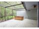 Screened-in patio with a hot tub, providing a peaceful outdoor space with lush greenery for relaxing and enjoying nature at 60 Birdsong Ct, Oldsmar, FL 34677