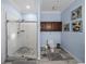 Bright bathroom showcasing a glass-enclosed shower with white subway tiles and modern fixtures at 7427 20Th St, Zephyrhills, FL 33540