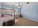 Comfortable bedroom with great natural light offers a four-poster bed and a vanity at 7427 20Th St, Zephyrhills, FL 33540