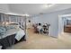 This spacious bedroom features a four-poster bed and opens to an en-suite bathroom at 7427 20Th St, Zephyrhills, FL 33540