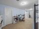 Spacious bedroom featuring a desk, shelving, and carpeted floors at 7427 20Th St, Zephyrhills, FL 33540