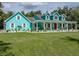 Charming two-story home with a large covered porch and beautifully landscaped front yard at 7427 20Th St, Zephyrhills, FL 33540