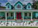 Inviting front porch featuring rocking chairs and elegant columns, perfect for relaxing at 7427 20Th St, Zephyrhills, FL 33540