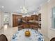 The kitchen is open to a breakfast nook, offering granite countertops, an island, and stainless appliances at 7427 20Th St, Zephyrhills, FL 33540